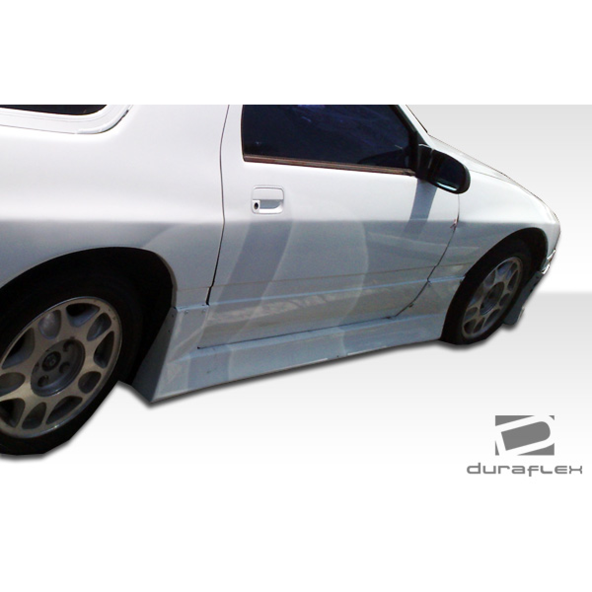 Modify your Mazda RX-7 1986 with our Exterior/Side Skirts - Side view angled from slightly above