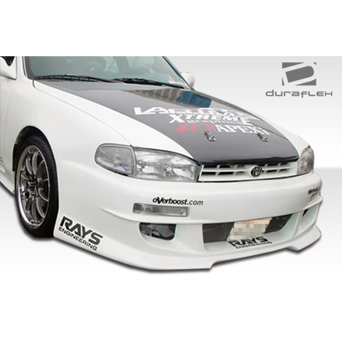 Modify your Toyota Camry 1992 with our Exterior/Complete Body Kits - Front angle view of bumper on white Toyota Camry