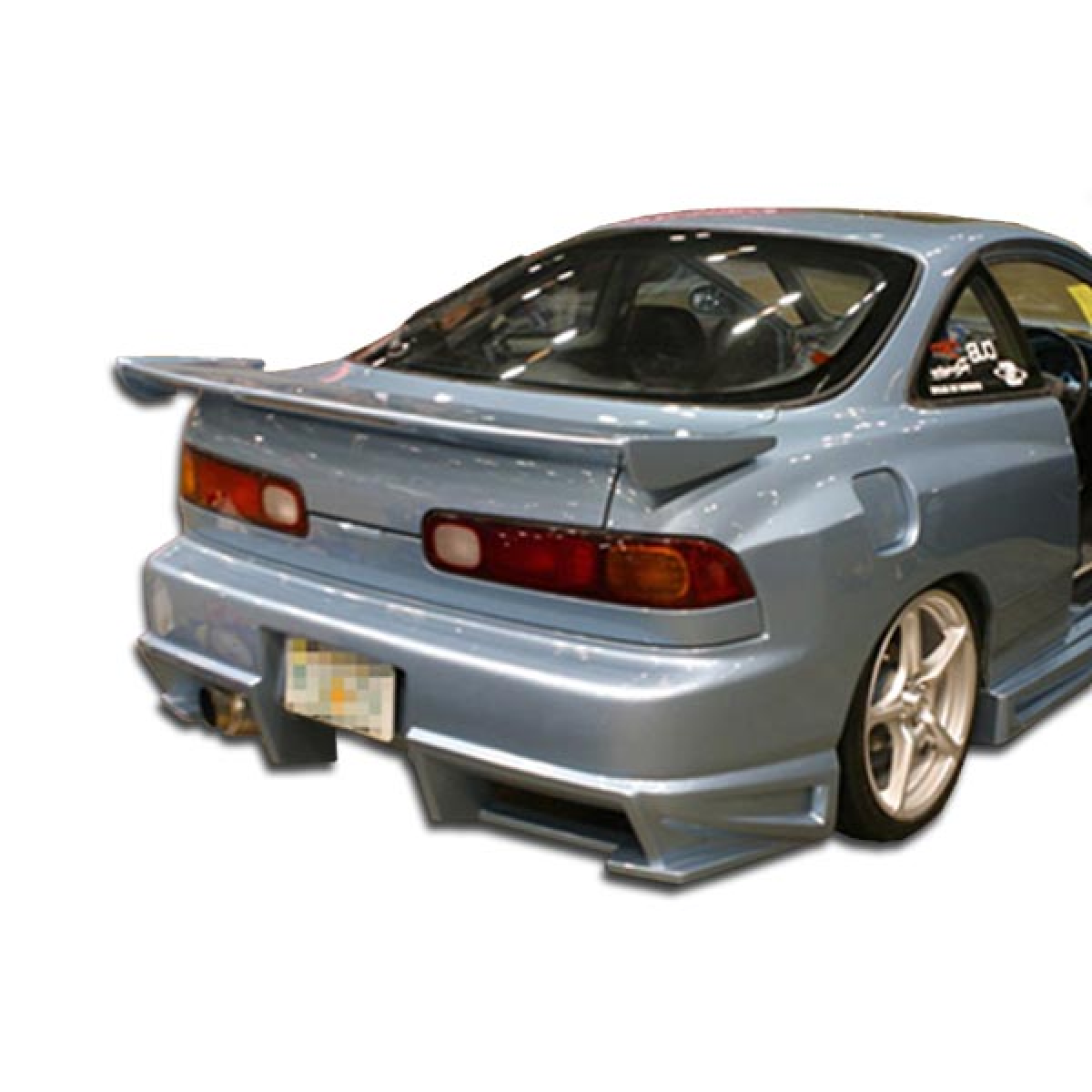 Modify your Acura Integra 1994 with our Exterior/Complete Body Kits - Rear view angle showing the rear bumper design