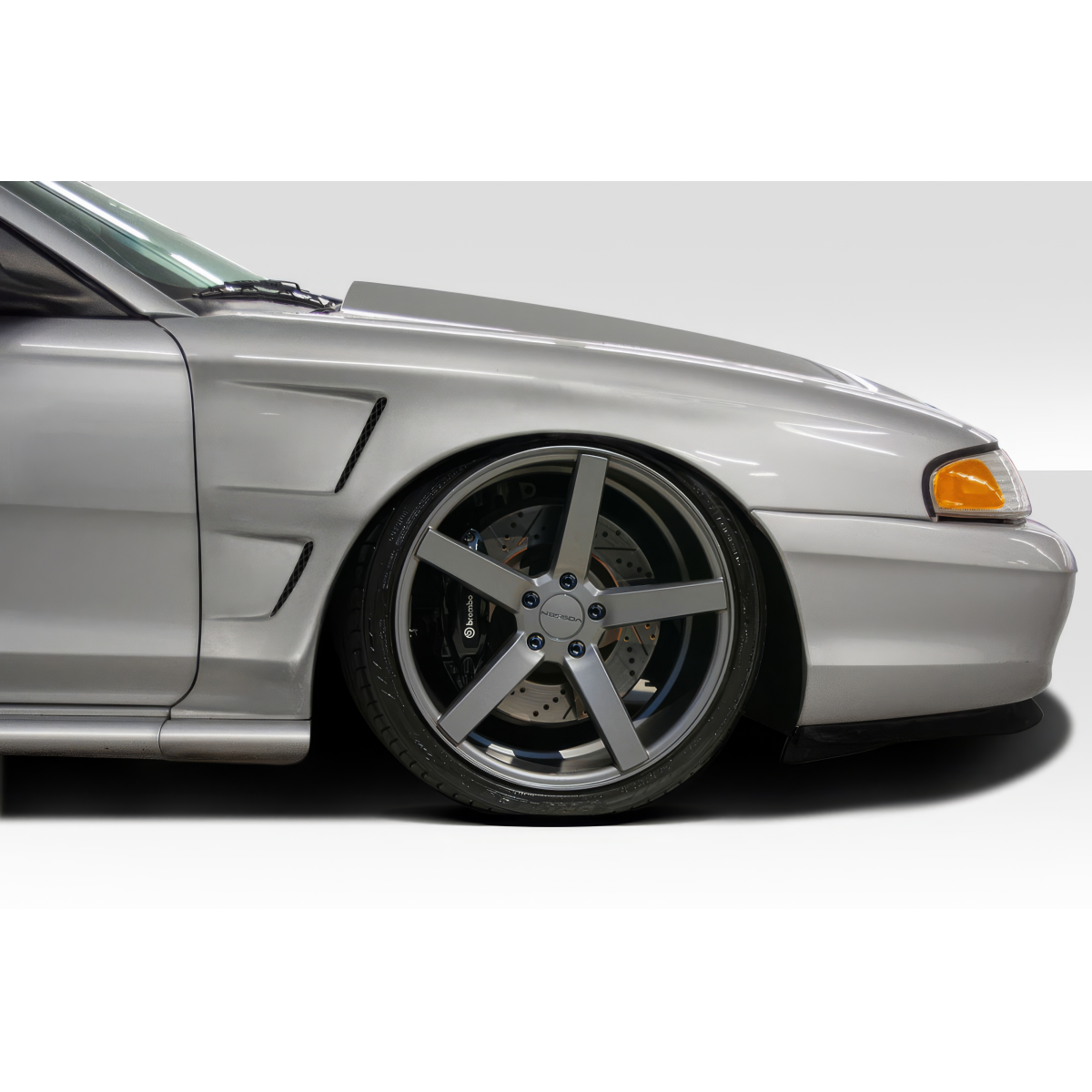 Modify your Ford Mustang 1994 with our Exterior/Fenders - Angle showing details of fender and wheel design