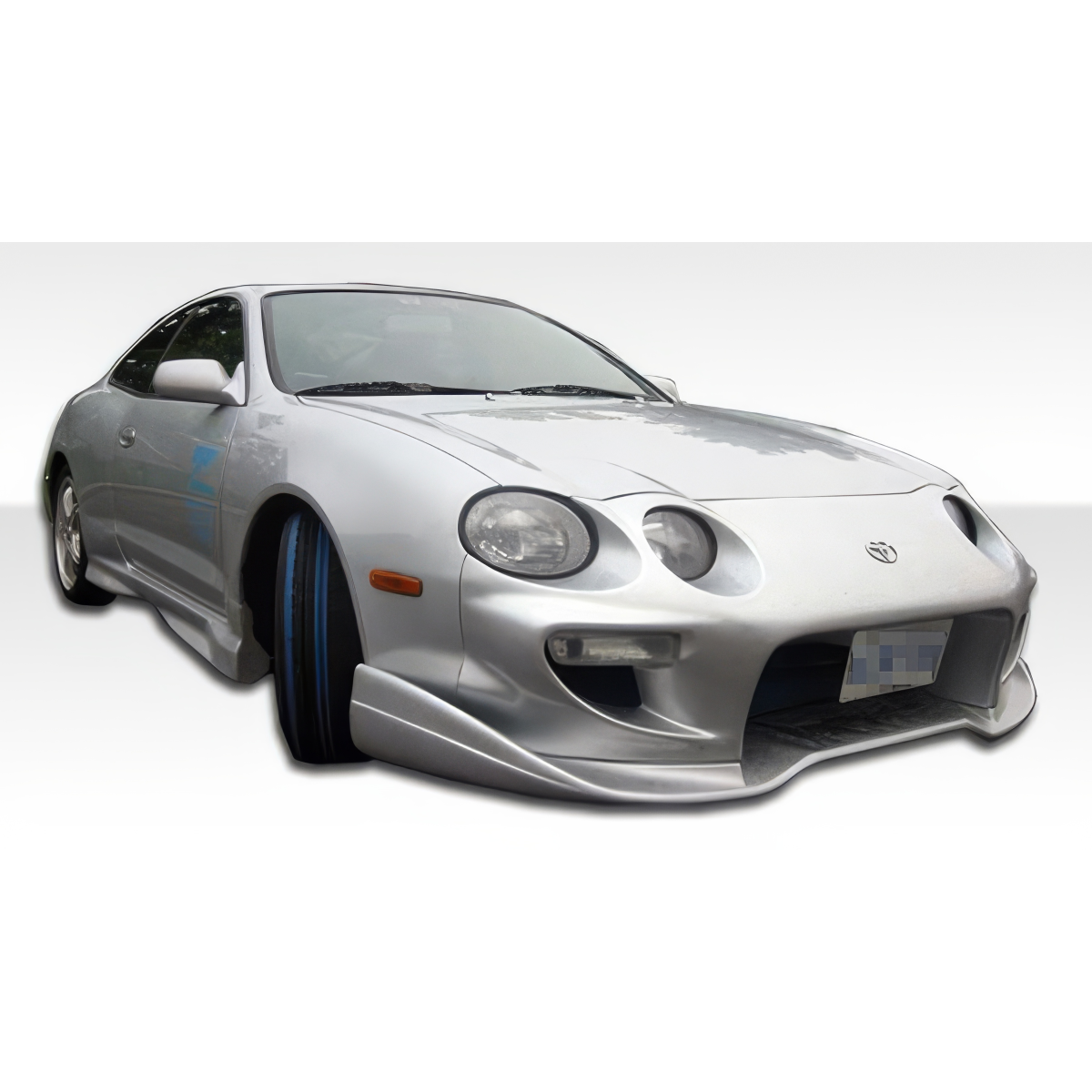 Modify your Toyota Celica 1994 with our Exterior/Complete Body Kits - Front angle showcasing the front bumper design