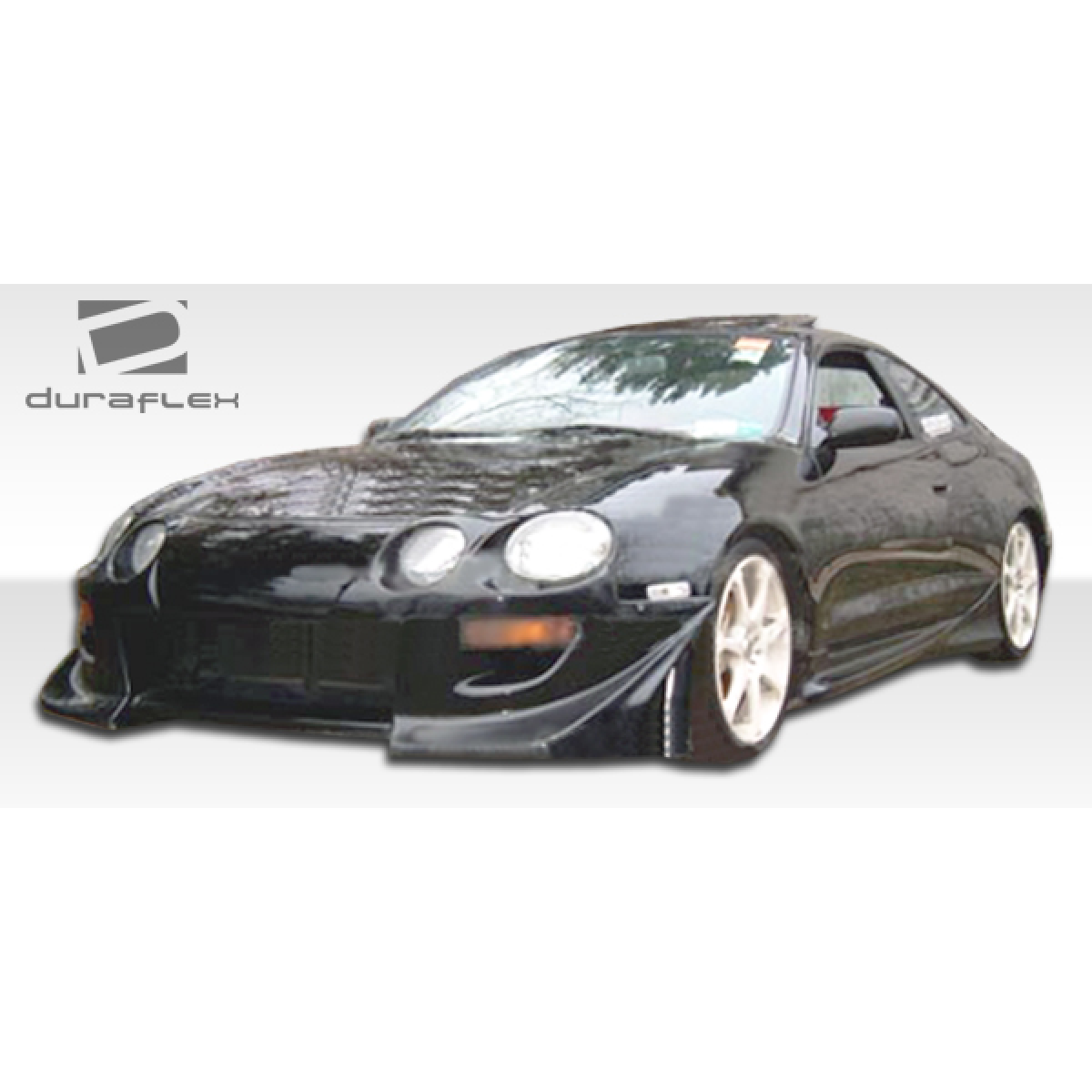 Modify your Toyota Celica 1994 with our Exterior/Side Skirts - Front angle view with low stance and wide body