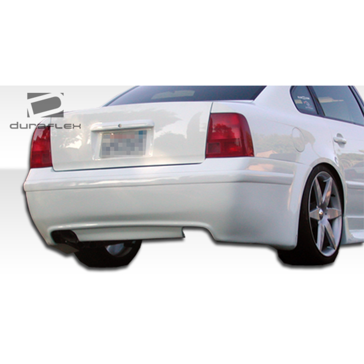Modify your Volkswagen Passat 1998 with our Exterior/Rear Bumpers - View from a slight angle from the rear right side