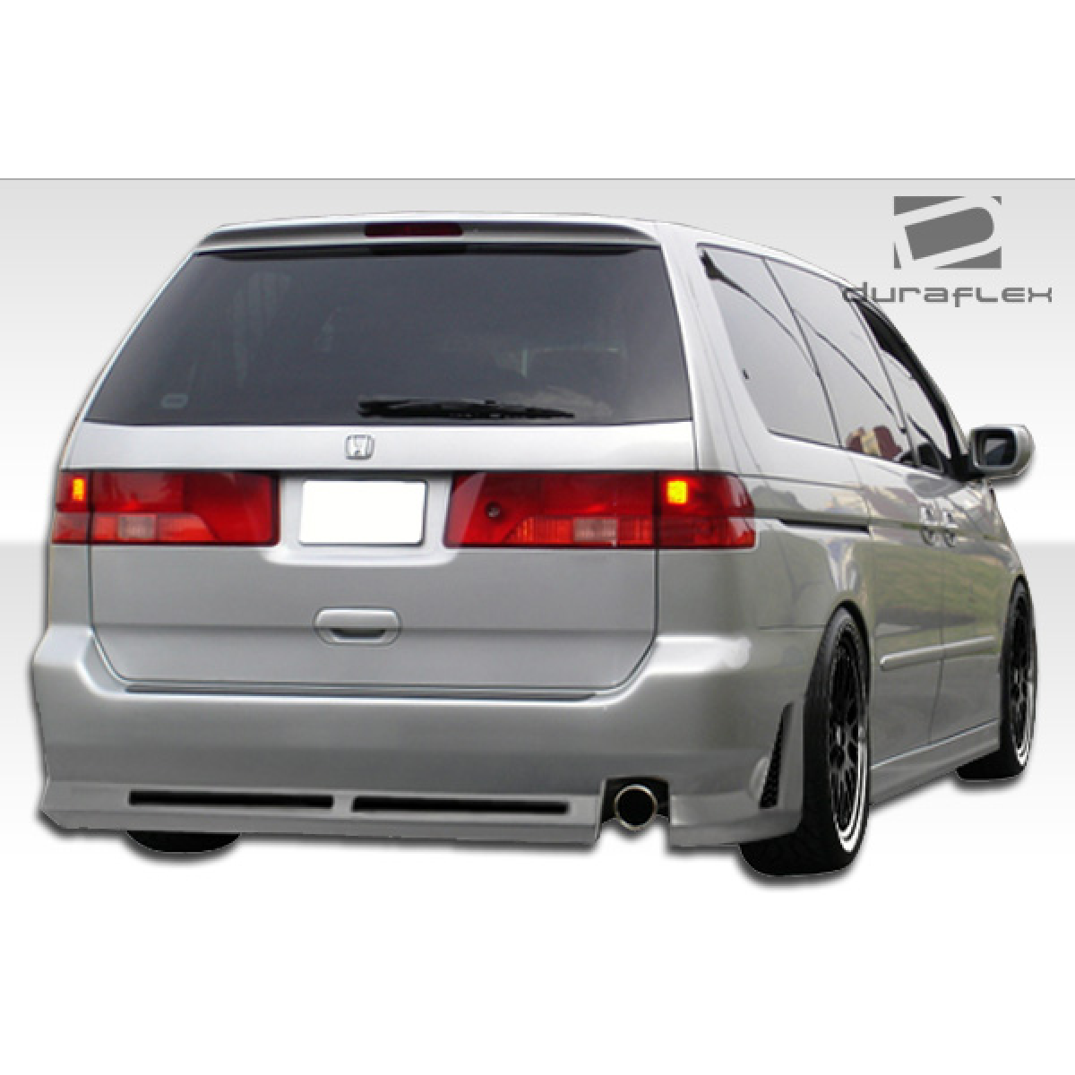 Modify your Honda Odyssey 1999 with our Exterior/Complete Body Kits - Rear view angle of vehicle showcasing side skirts