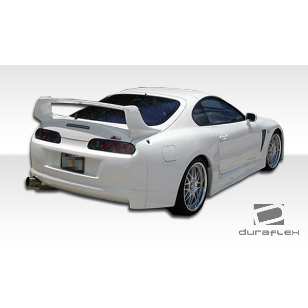 Modify your Toyota Supra 1993 with our Exterior/Rear Bumpers or Lips - Rear view of the car at a slight angle