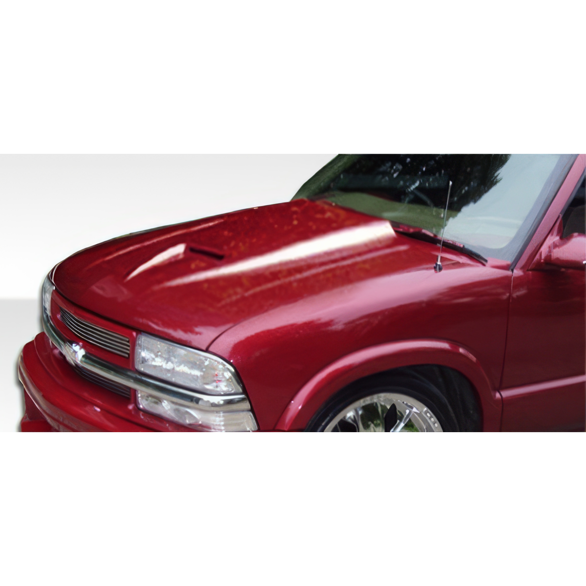 Modify your Chevrolet Blazer 1994 with our Exterior/Hoods - Front angle view of the vehicle hood