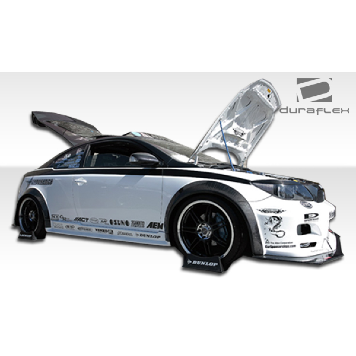 Modify your Scion tC 2005 with our Exterior/Complete Body Kits - The image shows the car from a side angle