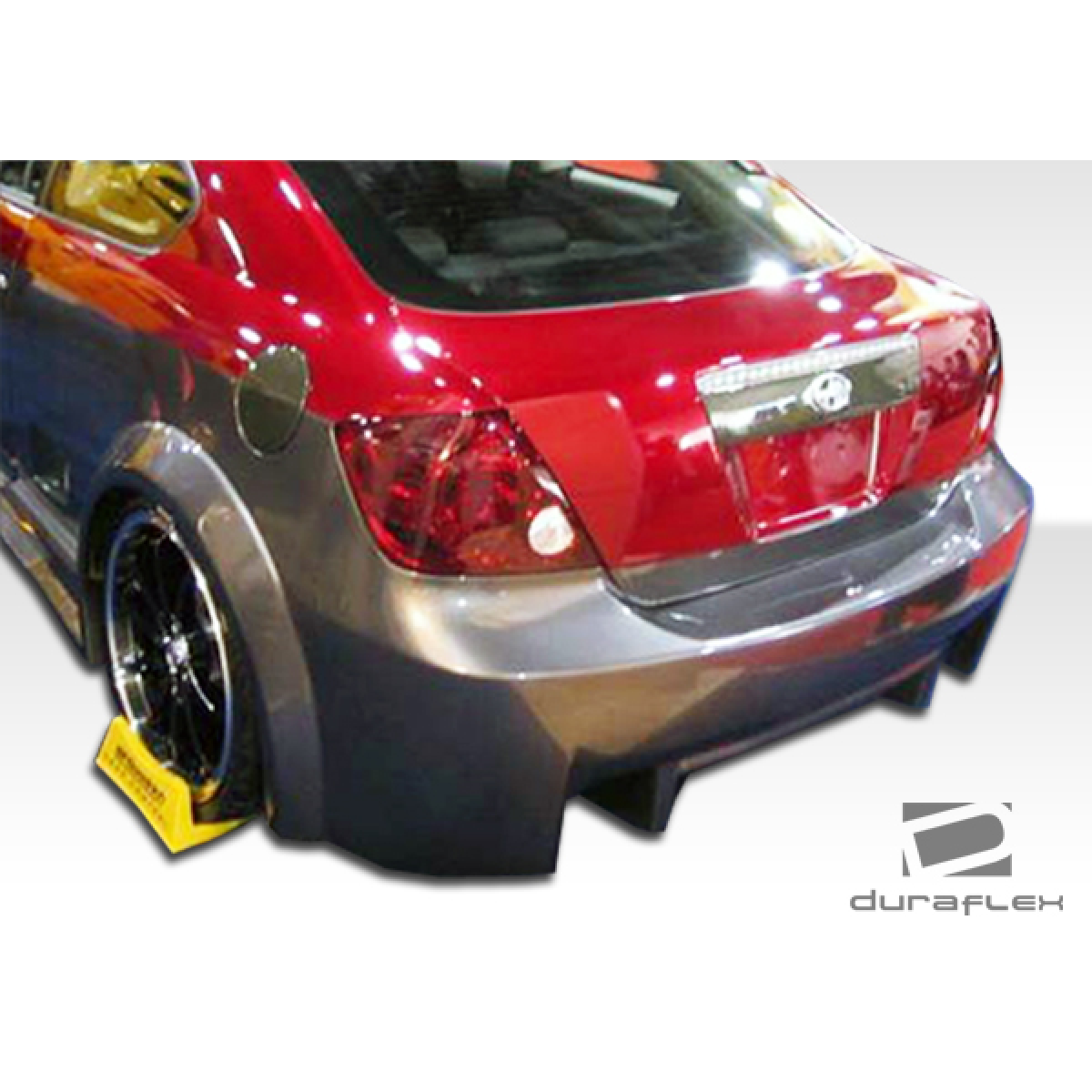 Modify your Scion tC 2005 with our Exterior/Rear Bumpers or Lips - Angled view showing rear body kit design