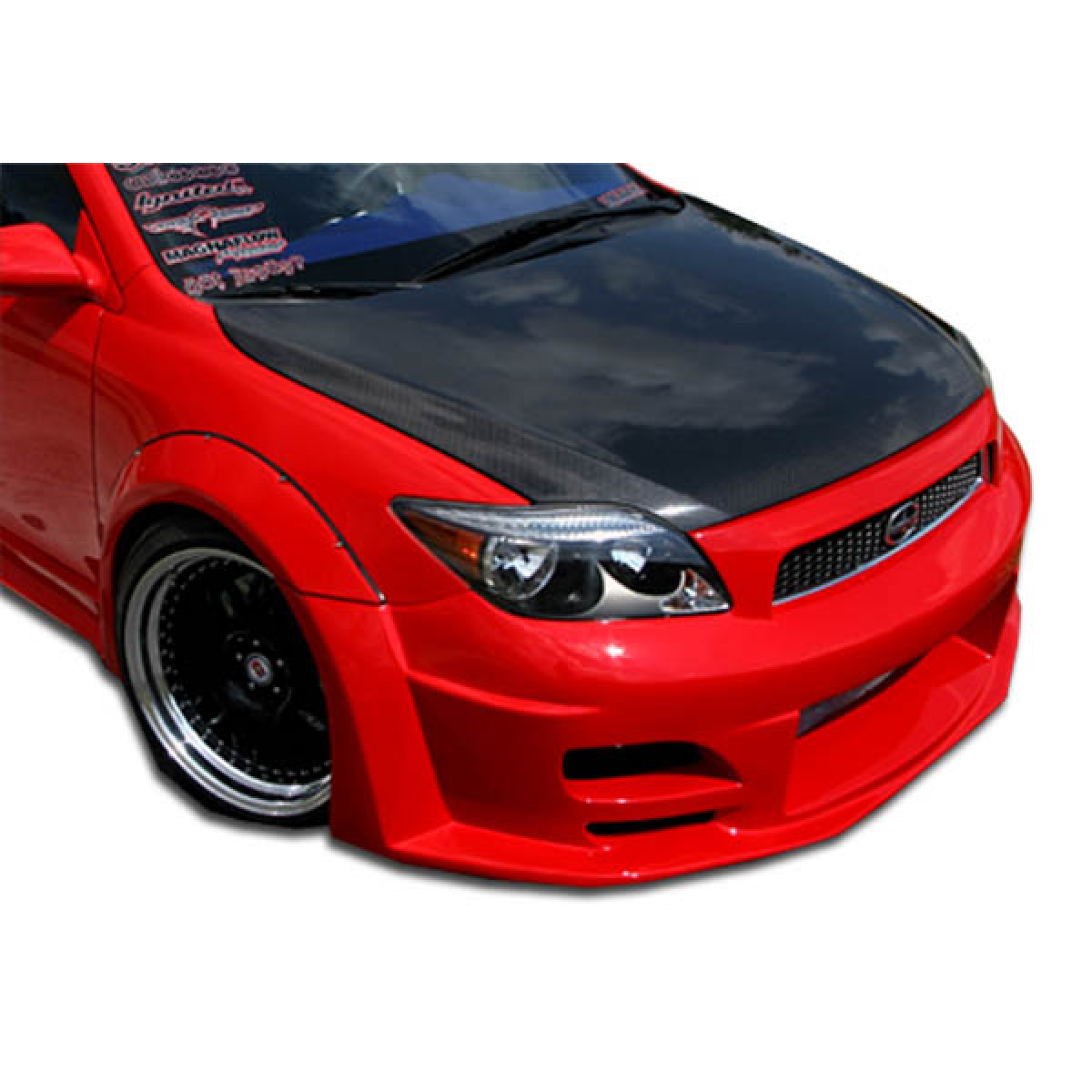 Modify your Scion tC 2005 with our Exterior/Complete Body Kits - Front three quarter angle view of red car