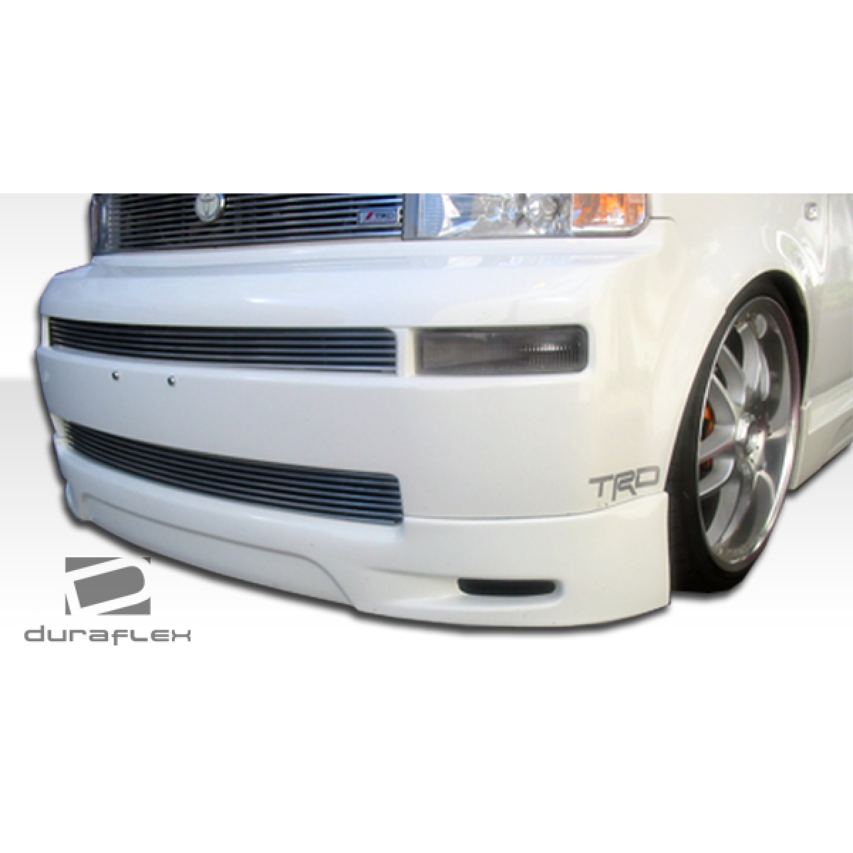 Modify your Scion xB 2004 with our Exterior/Complete Body Kits - Front view angle of the front lip on a car