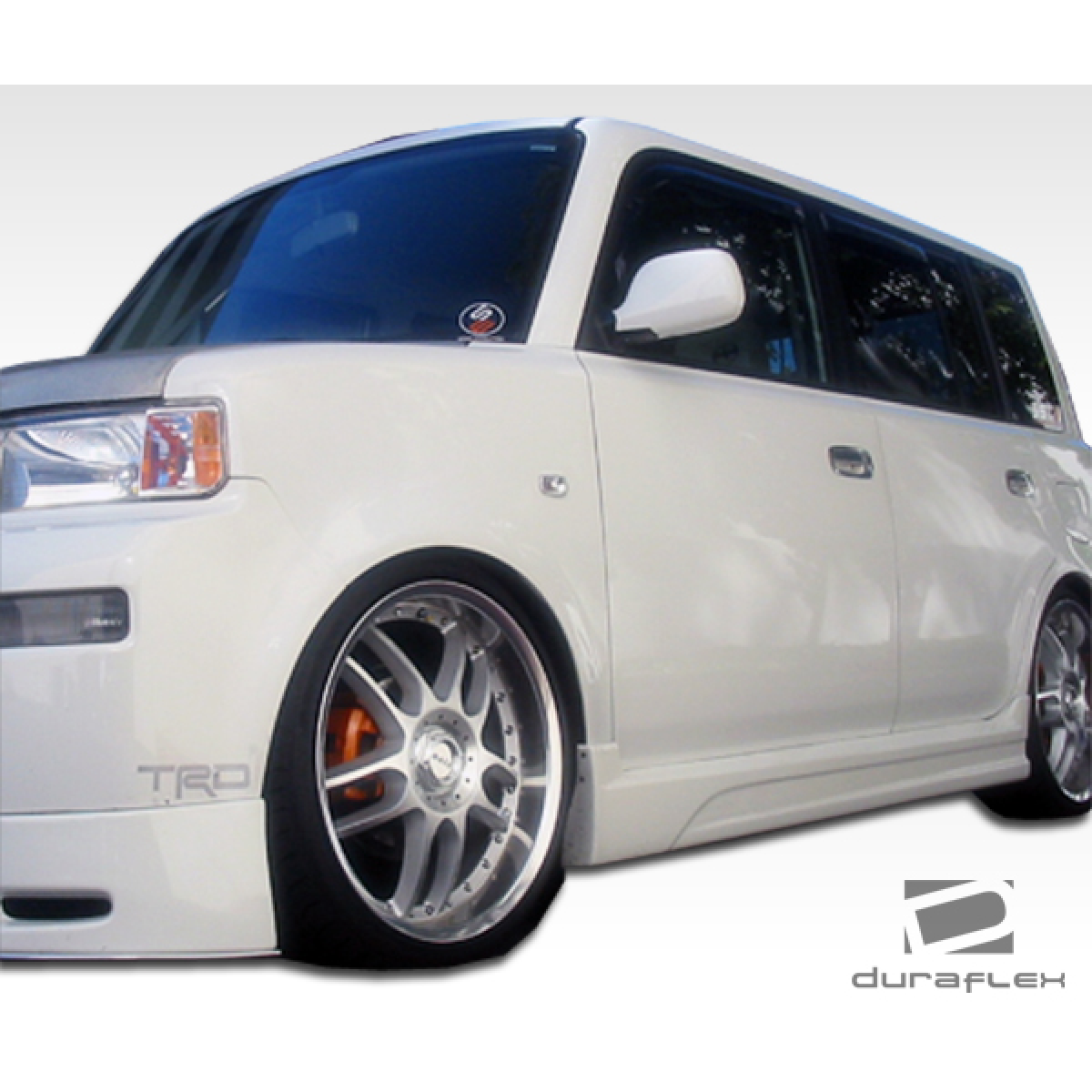 Modify your Scion xB 2004 with our Exterior/Complete Body Kits - Front angle showing side skirts and wheel details