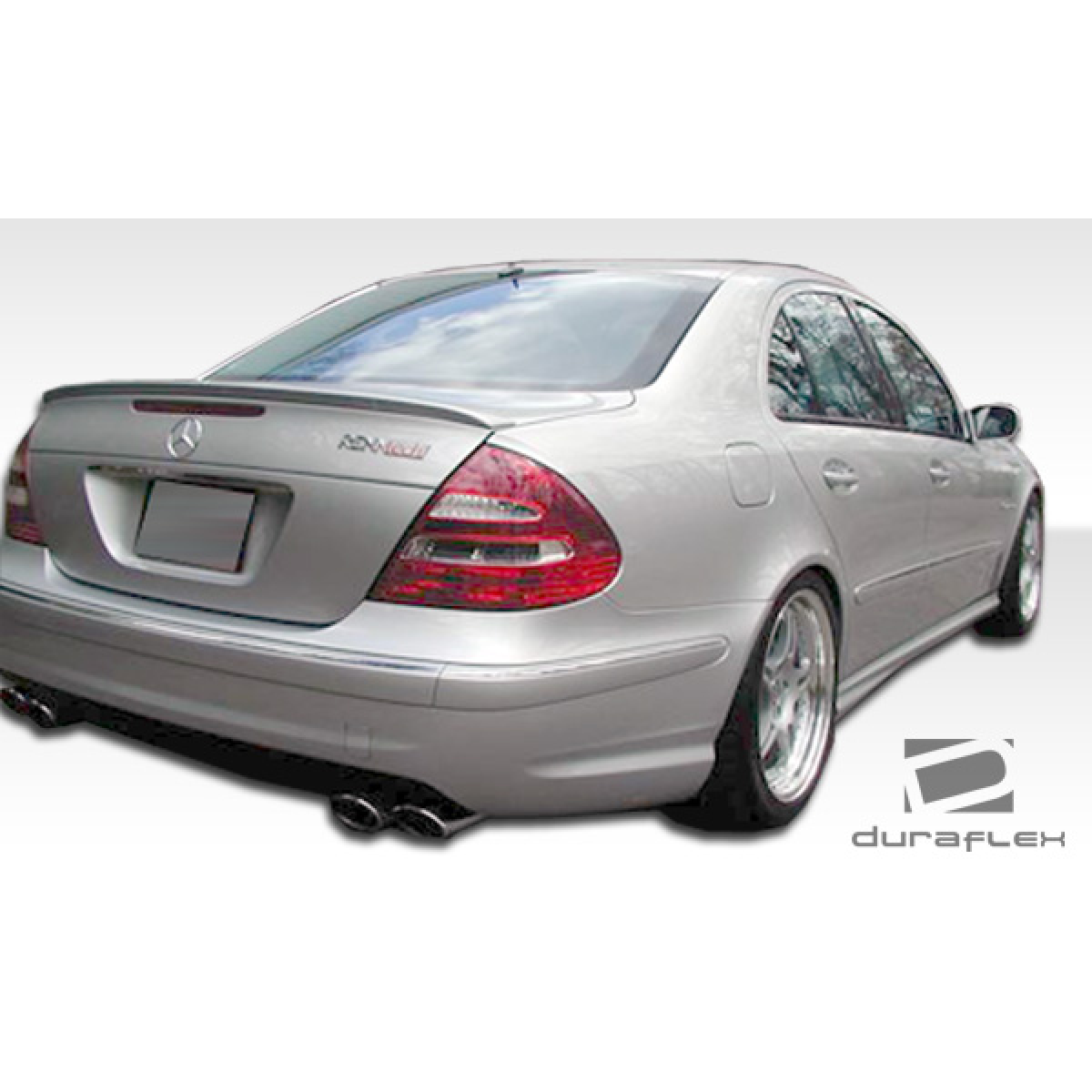 Modify your Mercedes-Benz E55 AMG 2003 with our Exterior/Side Skirts - Rear view at a slight angle from the right side