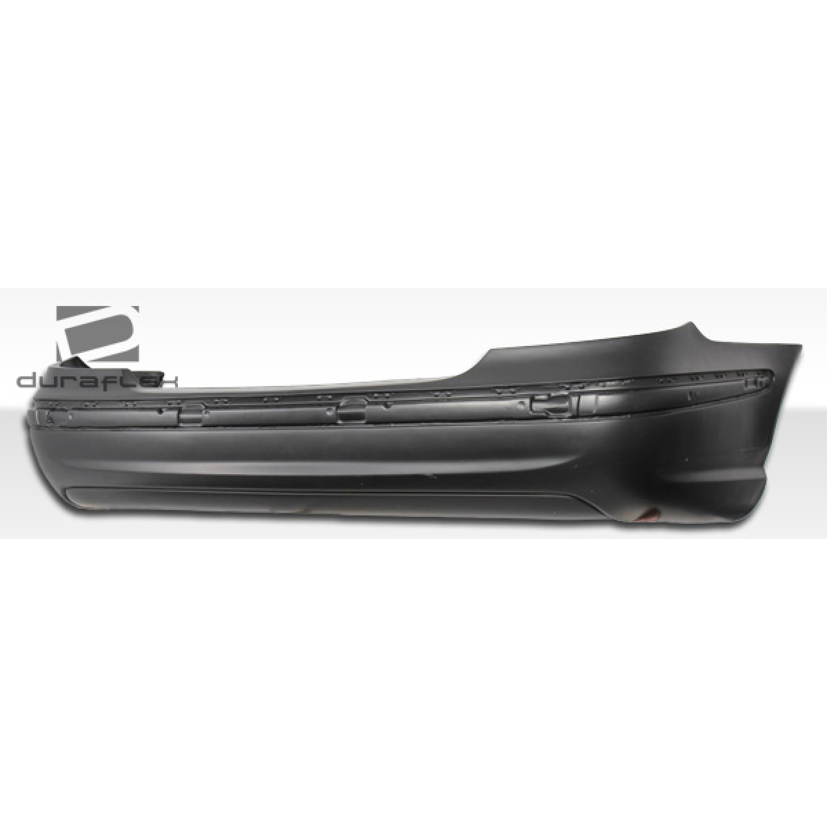 Modify your Mercedes-Benz E55 AMG 2003 with our Exterior/Rear Bumpers or Lips - Side view of rear bumper part angled horizontally