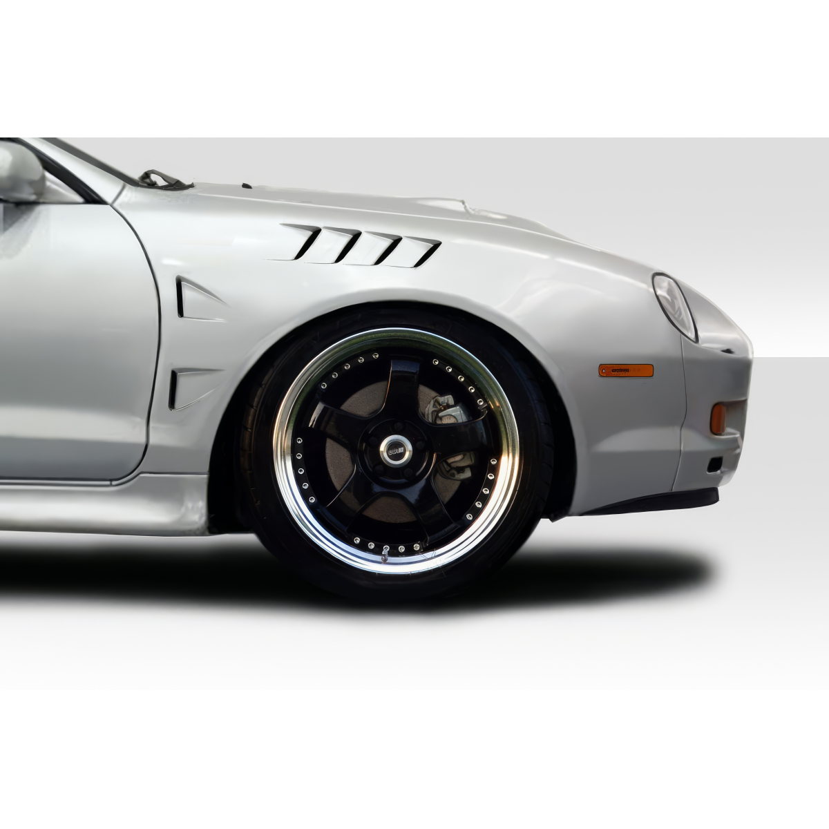 Modify your Toyota Celica 1994 with our Exterior/Fenders - Side angle view of the fender and wheel