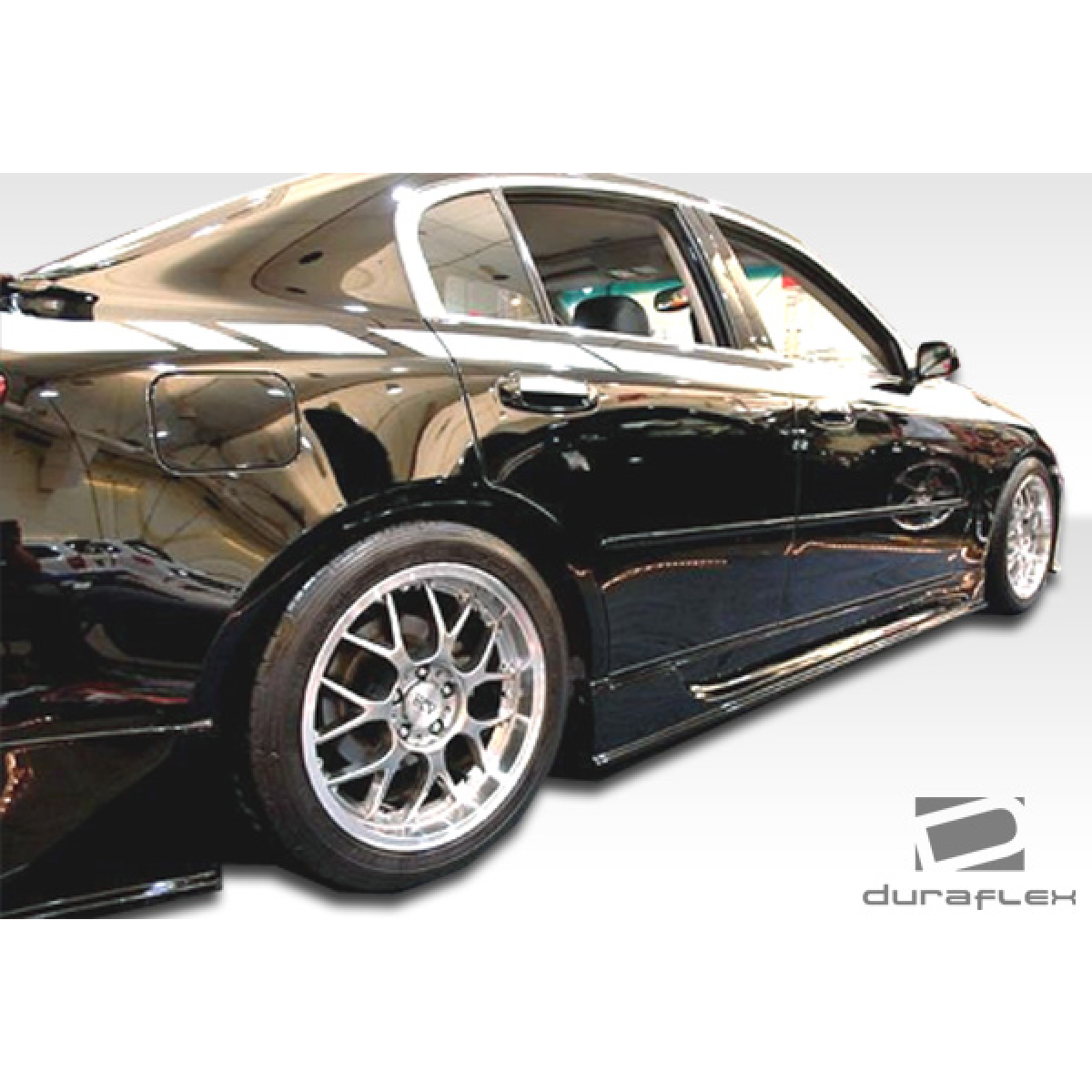 Modify your Infiniti G35 2003 with our Exterior/Complete Body Kits - Angled view of side skirt on black Infiniti G35