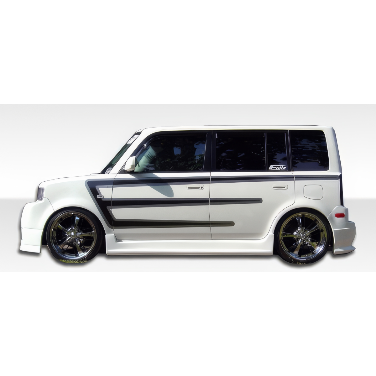 Modify your Scion xB 2004 with our Exterior/Side Skirts - Side view of vehicle at a horizontal angle