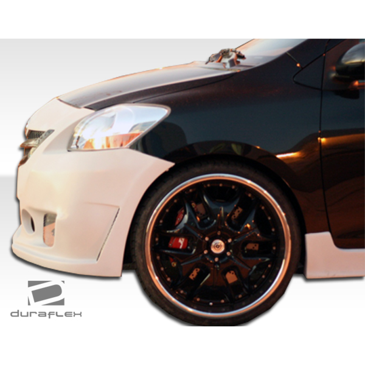 Modify your Toyota Yaris 2007 with our Exterior/Front Bumpers or Lips - Front angle view of a modified Toyota Yaris