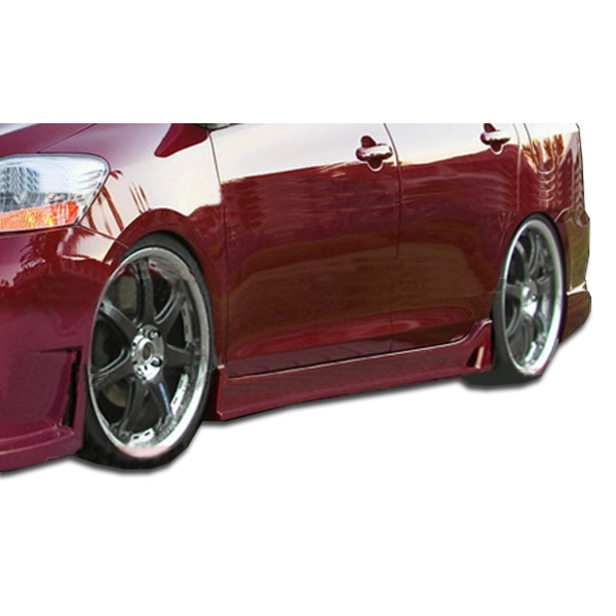 Modify your Toyota Yaris 2007 with our Exterior/Side Skirts - Side view of vehicle at low angle