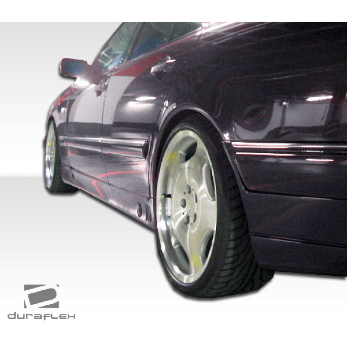 Modify your Mercedes-Benz E-Class 1996 with our Exterior/Side Skirts - Side angle view highlighting skirt design details