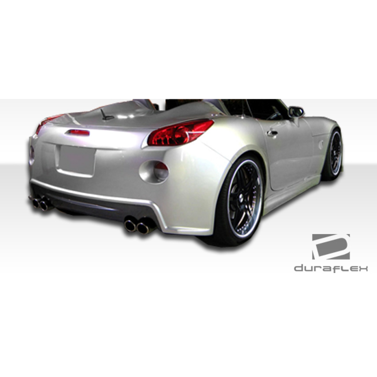 Modify your Pontiac Solstice 2006 with our Exterior/Side Skirts - Rear angle view of the vehicle showing body kit