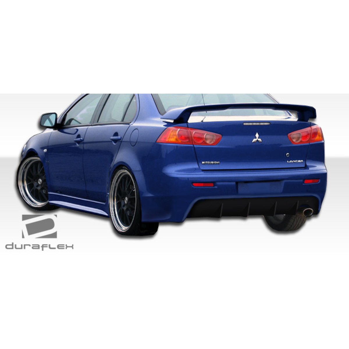 Modify your Mitsubishi Lancer 2008 with our Exterior/Rear Bumpers or Lips - Rear angle view of a blue Mitsubishi Lancer