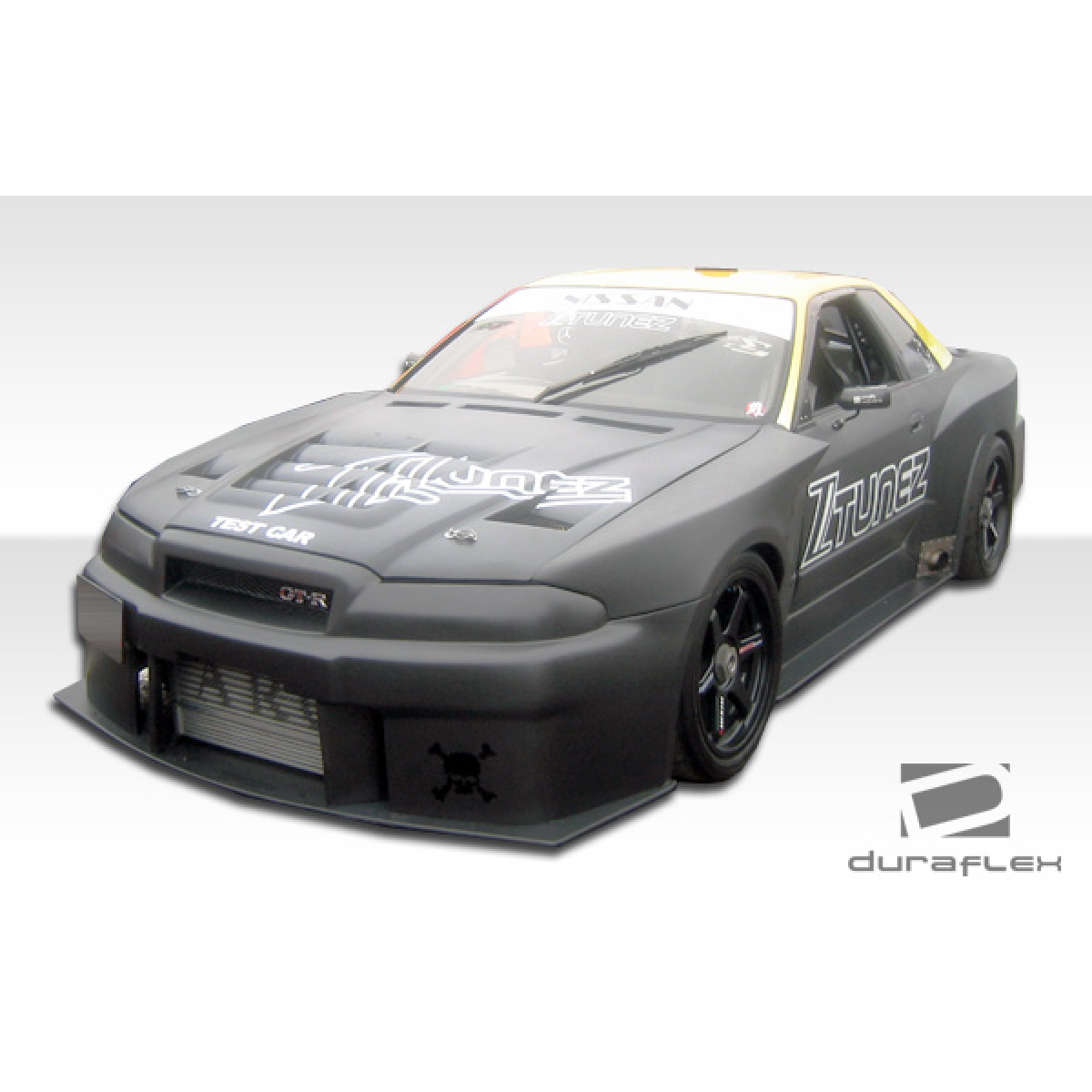 Modify your Nissan Skyline 1989 with our Exterior/Side Skirts - Front angle view of the vehicle