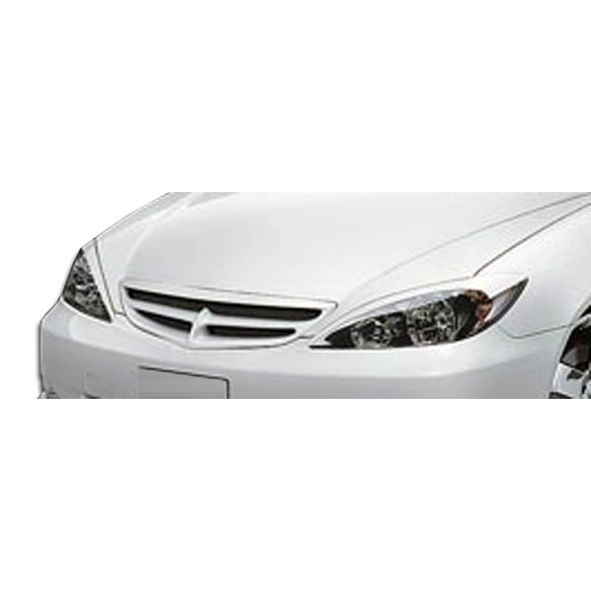 Modify your Toyota Camry 2002 with our Exterior/Complete Body Kits - Front angle view of a grille on a white vehicle