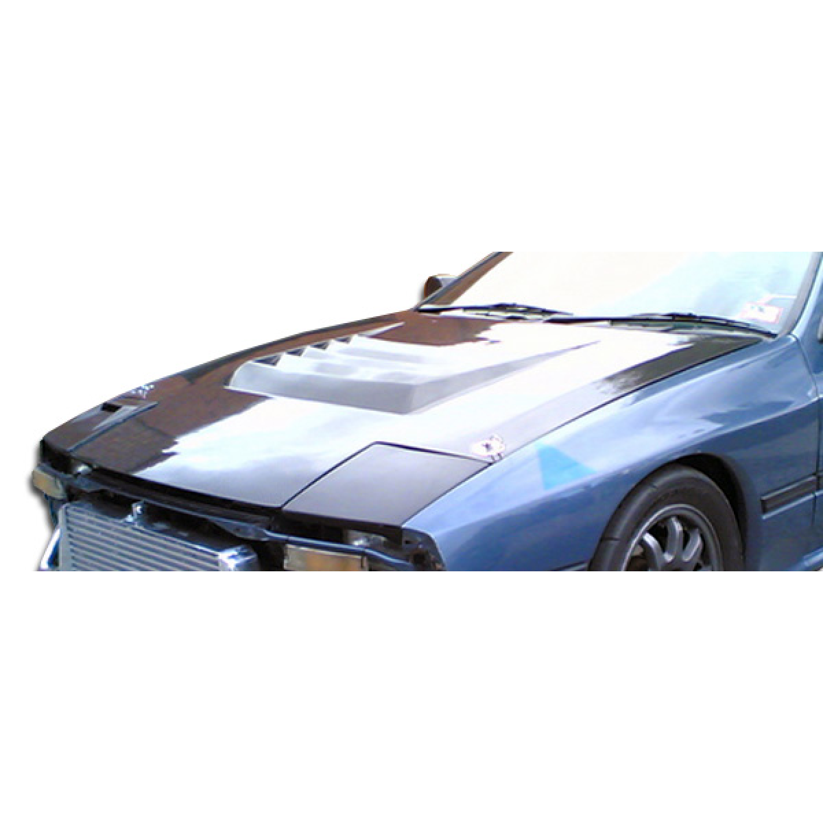 Modify your Mazda RX-7 1986 with our Exterior/Hoods - Top down view of car hood at slight angle