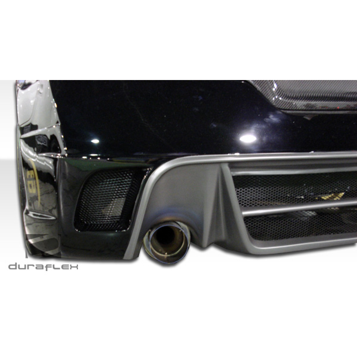 Modify your Nissan Altima 2008 with our Exterior/Rear Bumpers or Lips - Angled view of rear bumper and exhaust outlet