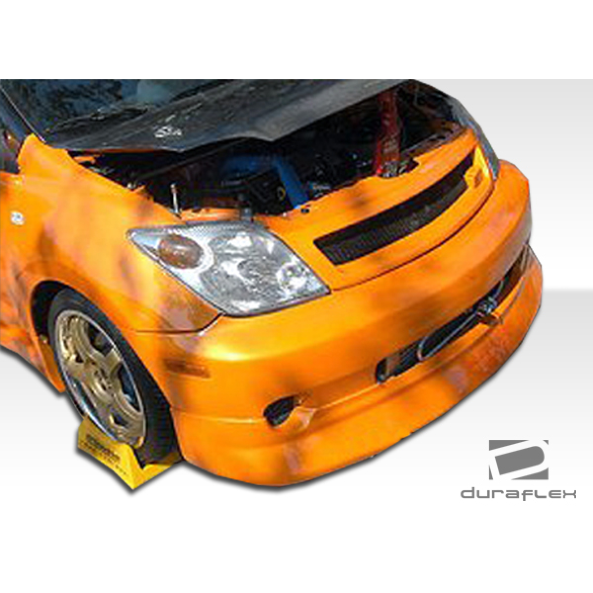 Modify your Scion xA 2004 with our Exterior/Grilles - Front angle with open hood showing grille