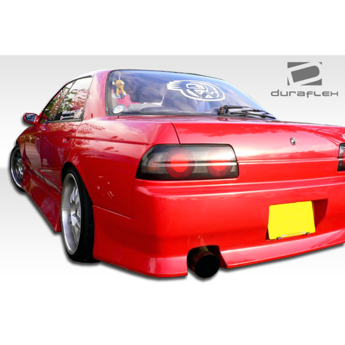 Modify your Nissan Skyline 1989 with our Exterior/Complete Body Kits - Rear angle view of custom red Nissan Skyline