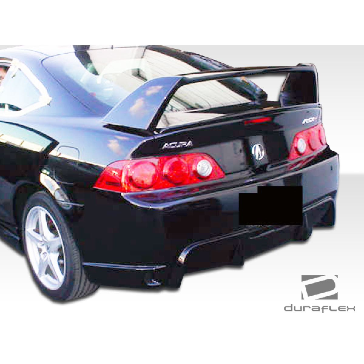 Modify your Acura RSX 2005 with our Exterior/Complete Body Kits - Rear angle view of vehicle showing bumper and wing