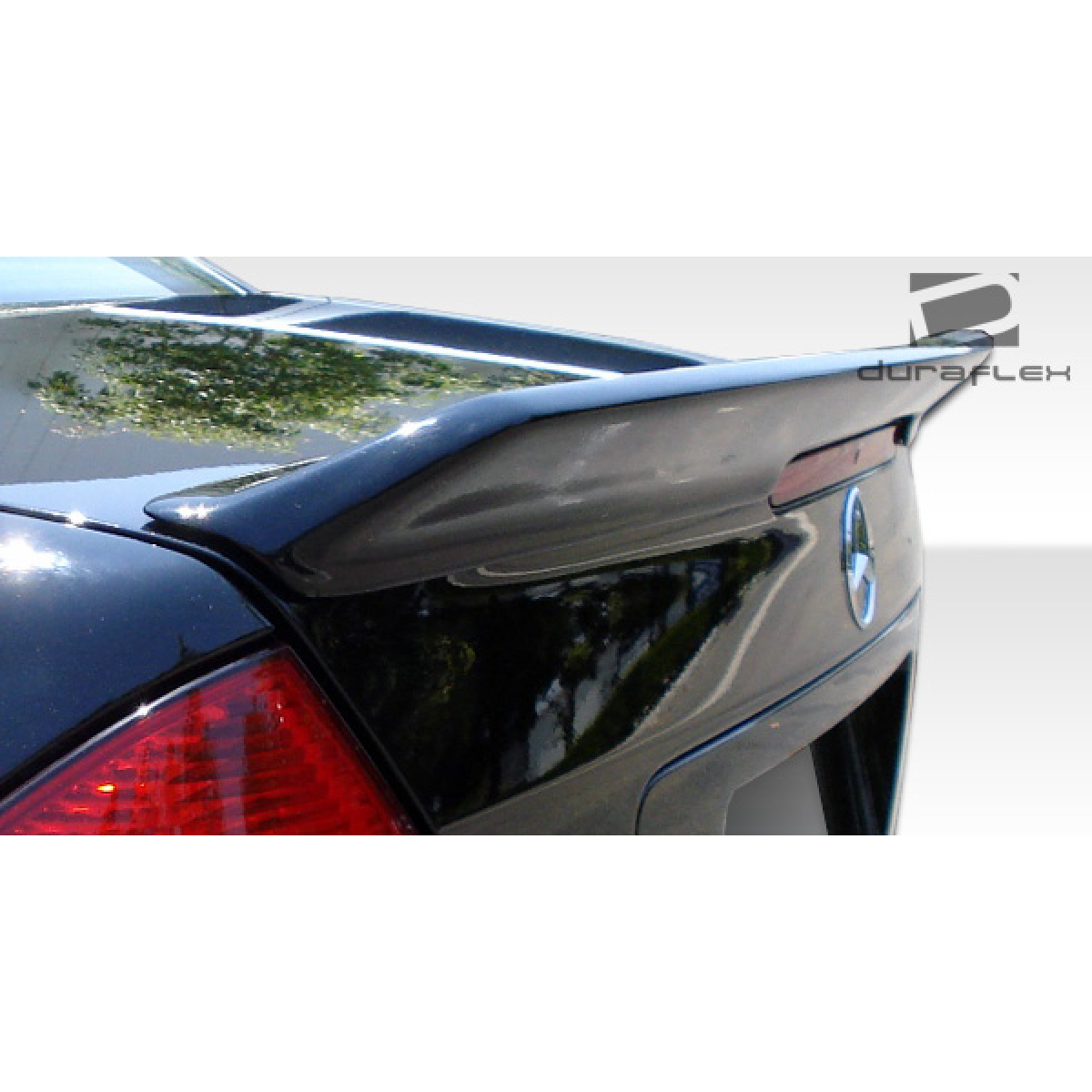 Modify your Mercedes-Benz C230 2001 with our Exterior/Wings - Angle view of the rear trunk with a wing