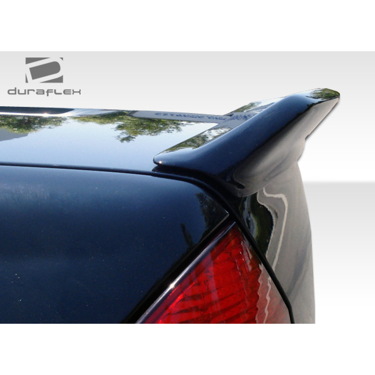 Modify your Mercedes-Benz C230 2001 with our Exterior/Wings - Spoiler viewed from a rear angle on the trunk lid