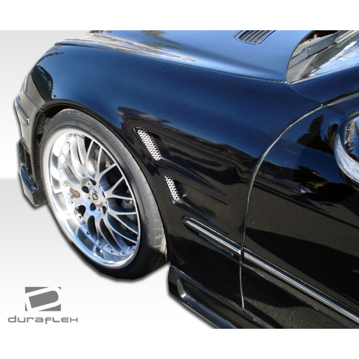 Modify your Mercedes-Benz C230 2001 with our Exterior/Fenders - Angled view of front fender and wheel