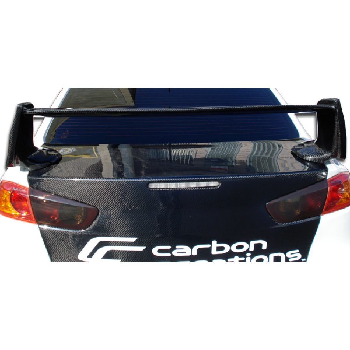 Modify your Mitsubishi Evolution 2008 with our Exterior/Wings - Rear view angle of the car with the wing