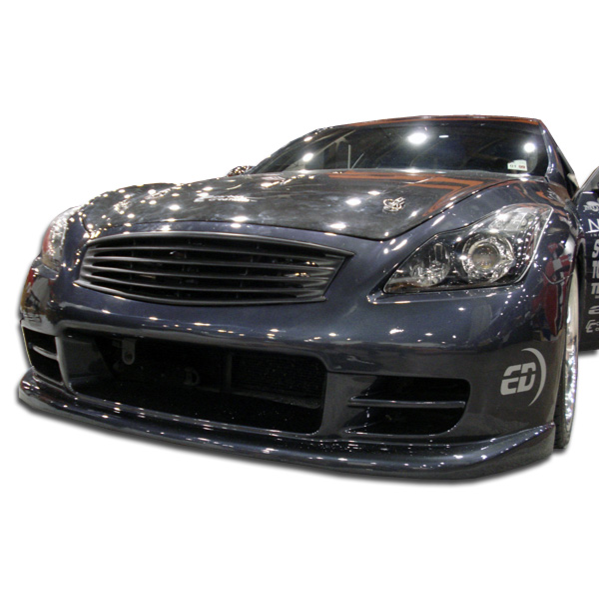 Modify your Infiniti G37 2008 with our Exterior/Complete Body Kits - Front view at a low angle showing bumper design