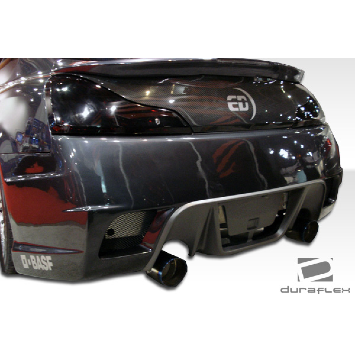 Modify your Infiniti G37 2008 with our Exterior/Complete Body Kits - Rear angle showing upper bumper and exhaust tips