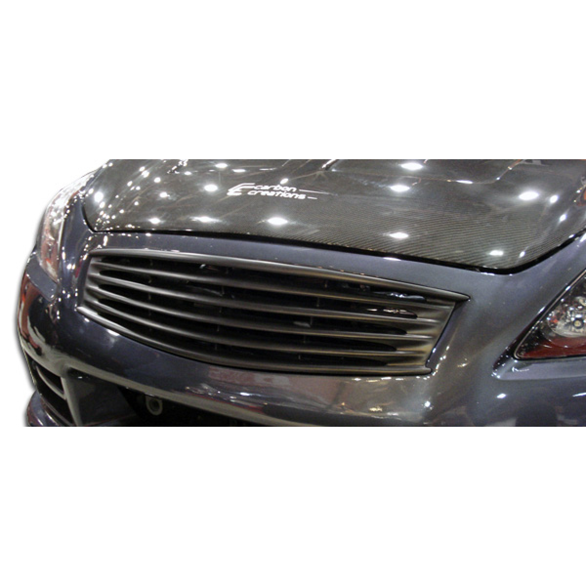 Modify your Infiniti G37 2008 with our Exterior/Grilles - Front view of grille at a slight angle