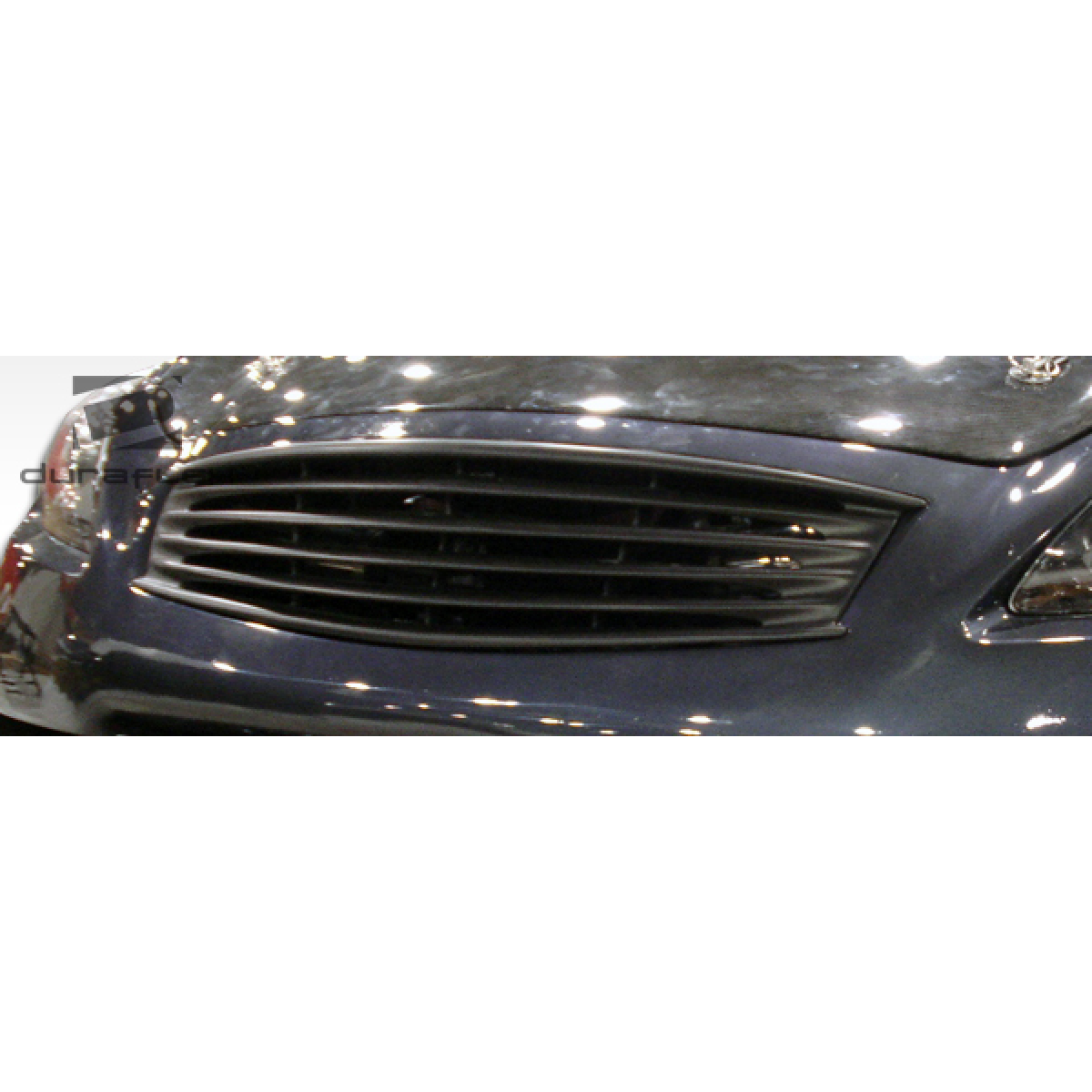 Modify your Infiniti G37 2008 with our Exterior/Grilles - Front view showing the grille at a slight angle