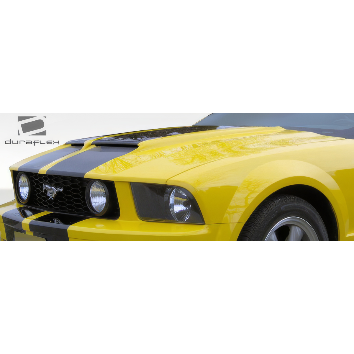 Modify your Ford Mustang 2005 with our Exterior/Hoods - Front angle view of a yellow mustang hood