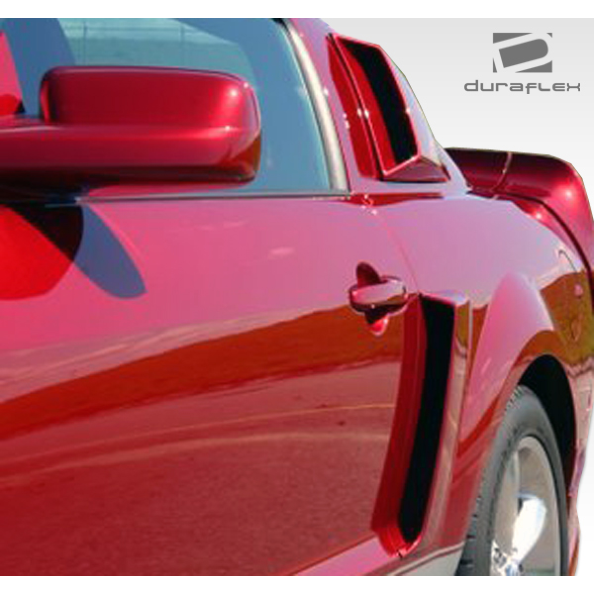 Modify your Ford Mustang 2005 with our Exterior/Scoops - Side view angle of red Mustang showing scoop part