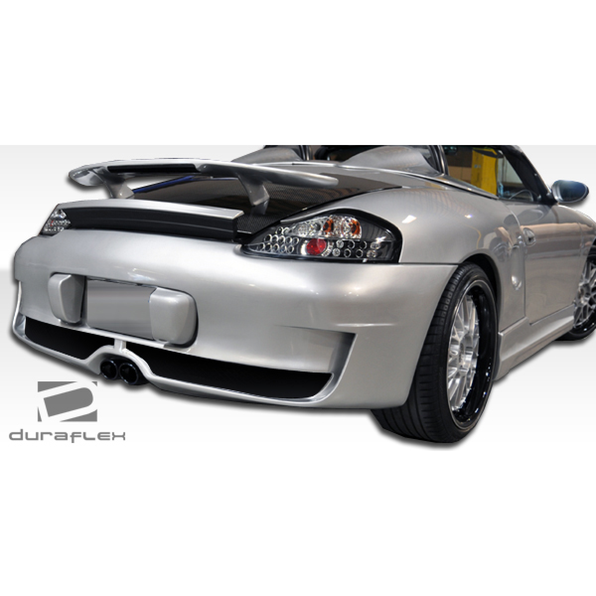 Modify your Porsche Boxster 1997 with our Exterior/Rear Bumpers or Lips - Rear angle showing the bumper design and style