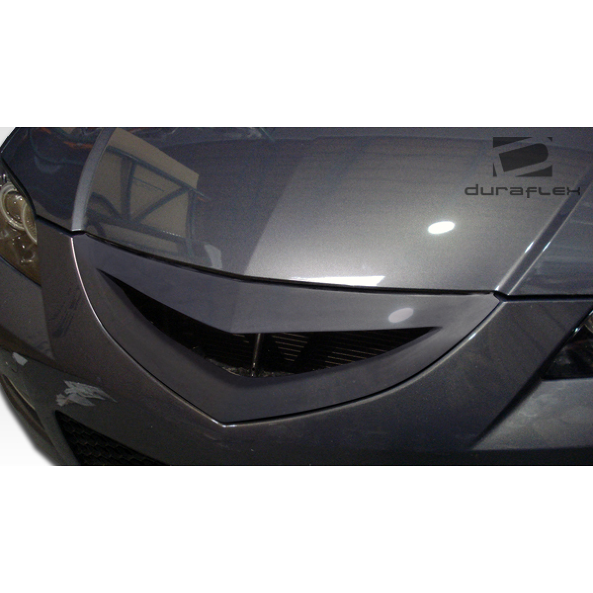 Modify your Mazda 3 2004 with our Exterior/Grilles - Part is viewed from a top down angle