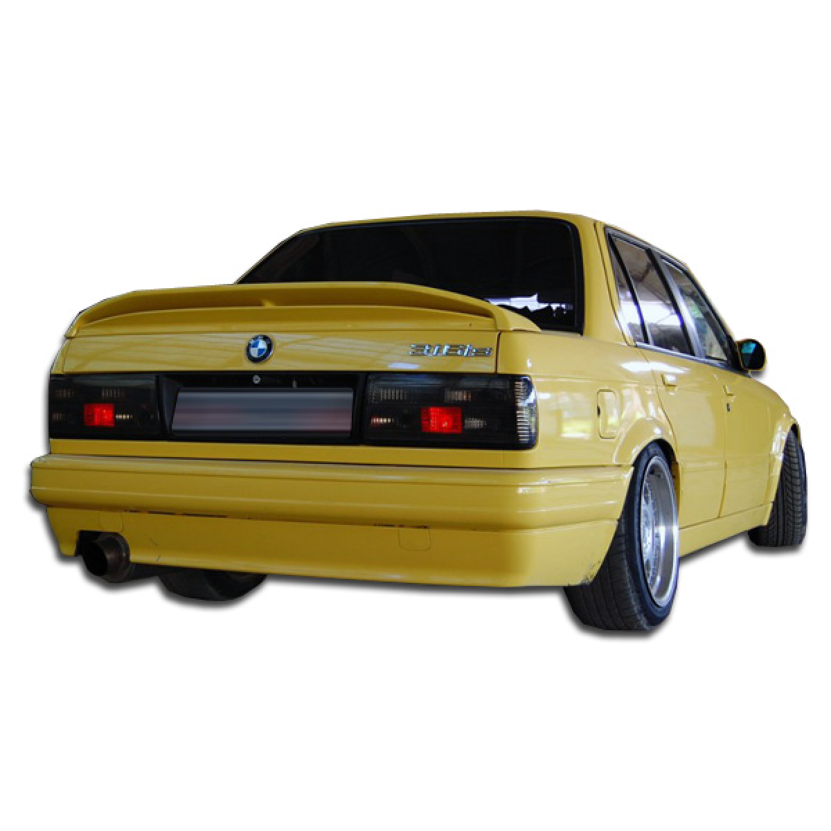 Modify your BMW 3-Series 1988 with our Exterior/Complete Body Kits - Rear angle view of a yellow BMW 3 Series