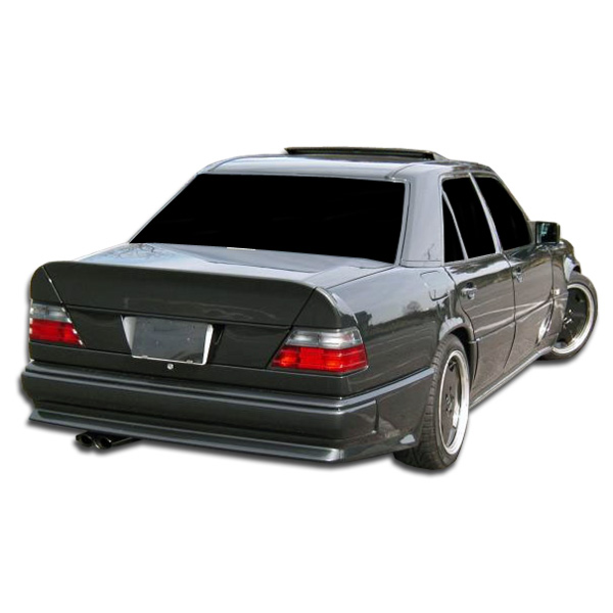 Modify your Mercedes-Benz E-Class 1986 with our Exterior/Complete Body Kits - Rear view angle of the vehicle seen from the side