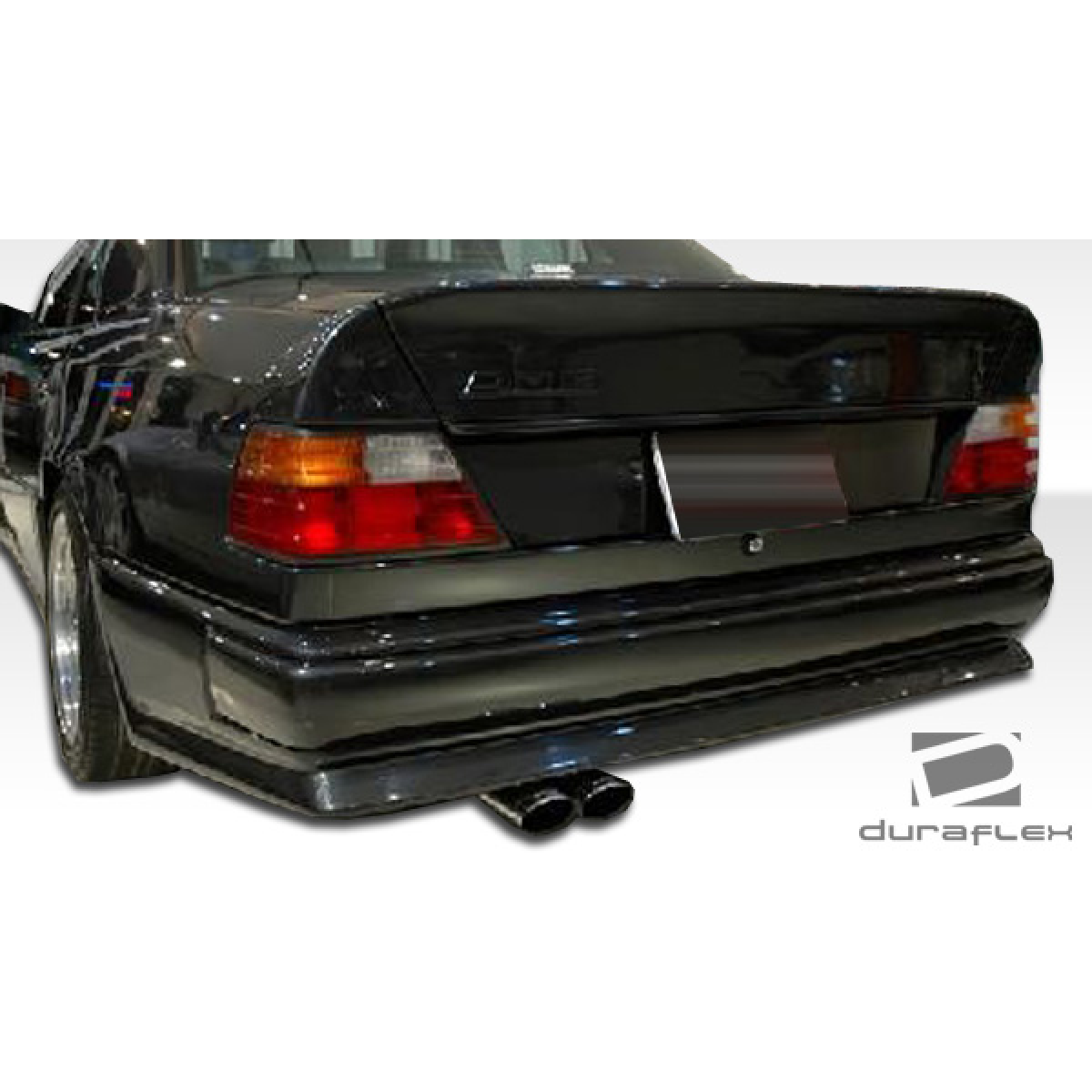 Modify your Mercedes-Benz E-Class 1986 with our Exterior/Complete Body Kits - Rear view at a slight angle from the side