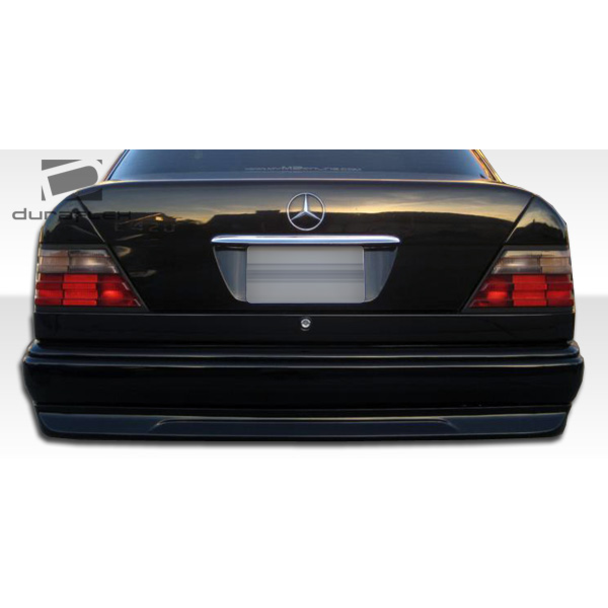 Modify your Mercedes-Benz C-Class 1986 with our Exterior/Rear Bumpers or Lips - Rear view of the vehicle at a straight angle