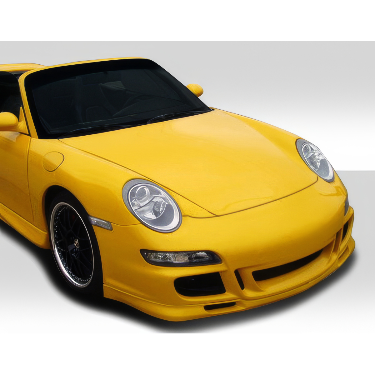 Modify your Porsche 911 1999 with our Exterior/Complete Body Kits - Front angle view of a yellow Porsche 911