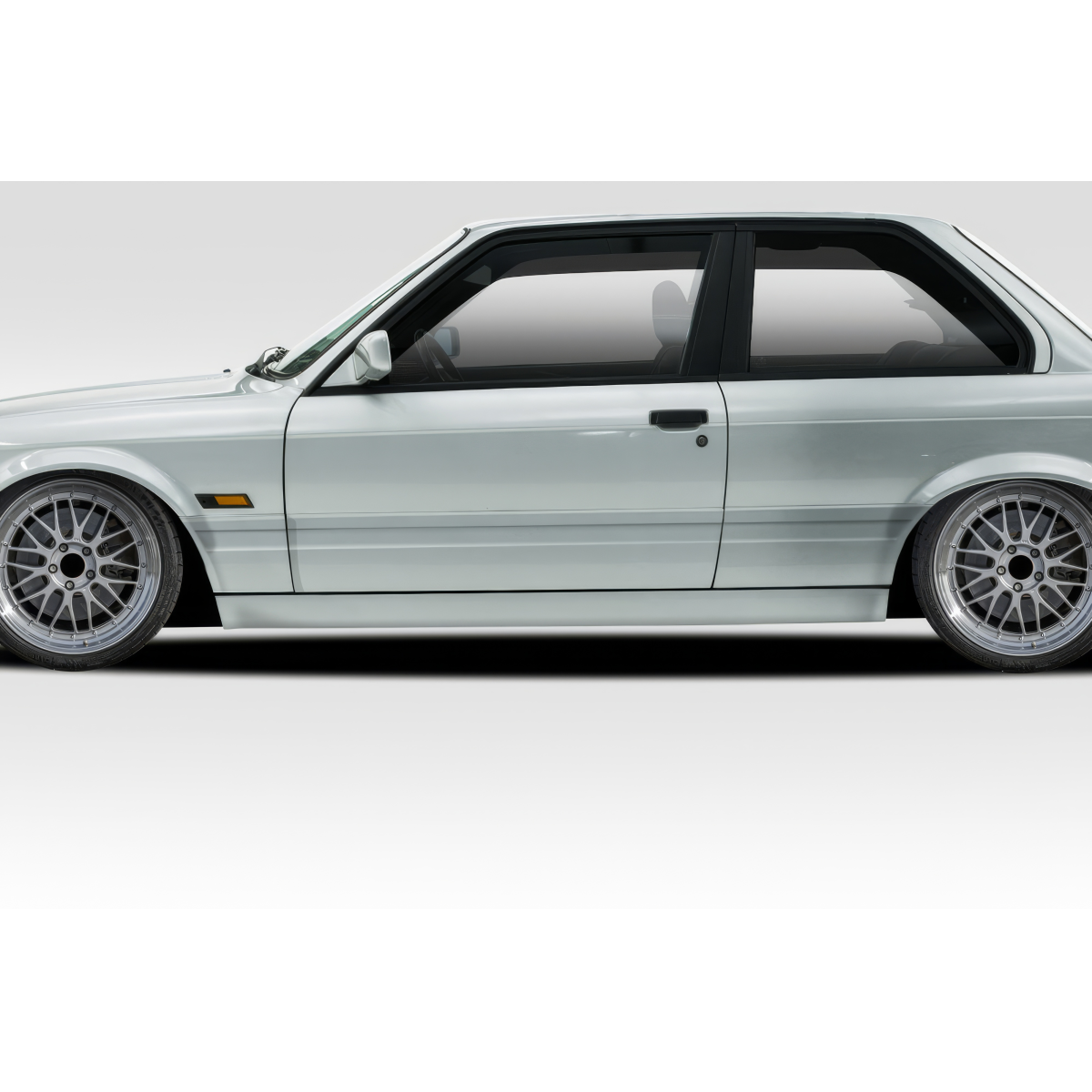 Modify your BMW 3-Series 1988 with our Exterior/Complete Body Kits - Side angle view of modified BMW 3 Series E30